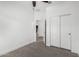Bright bedroom features wood-look flooring, ceiling fan, and closet with sliding doors at 2368 E Bellerive Dr, Gilbert, AZ 85298
