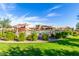 Wonderful community pool area with seating, umbrellas and surrounded by lush greenery at 2368 E Bellerive Dr, Gilbert, AZ 85298