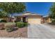Charming single-story home featuring a two-car garage, desert landscaping, and a well-maintained front yard at 2368 E Bellerive Dr, Gilbert, AZ 85298