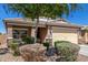 Front exterior view of a single-Gathering home with desert landscaping and a two-car garage in a residential area at 2368 E Bellerive Dr, Gilbert, AZ 85298