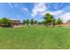 Expansive green space with mature trees, providing a peaceful and open environment in a residential area at 2368 E Bellerive Dr, Gilbert, AZ 85298