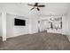 Spacious living room featuring tile floors, recessed lighting, ceiling fan and an open floor plan at 2368 E Bellerive Dr, Gilbert, AZ 85298