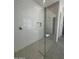 Walk-in shower boasts designer tile, a rain shower head and glass enclosure at 24000 S 218Th Pl, Queen Creek, AZ 85142