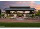 Beautifully lit community pavilion with ample seating and BBQ stations for outdoor gatherings at 24000 S 218Th Pl, Queen Creek, AZ 85142