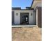 Inviting entryway with stylish lighting fixtures and a modern front door at 24000 S 218Th Pl, Queen Creek, AZ 85142