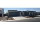 Charming single-story home featuring a two car garage and a welcoming entrance accented with beautiful landscaping at 24000 S 218Th Pl, Queen Creek, AZ 85142