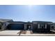 Attractive single-story home boasting modern architectural design, and tasteful landscaping at 24000 S 218Th Pl, Queen Creek, AZ 85142