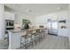 Spacious kitchen with a large center island, stainless steel appliances, and plenty of seating at 24000 S 218Th Pl, Queen Creek, AZ 85142
