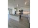 Chef's kitchen boasts a center island, modern stainless hood, white cabinets and hard surface flooring at 24000 S 218Th Pl, Queen Creek, AZ 85142