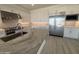 Gourmet kitchen featuring sleek white cabinets, stainless steel appliances, an island and stunning stone countertops at 24000 S 218Th Pl, Queen Creek, AZ 85142
