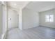 The living room has many windows and light gray wood-look floors at 24000 S 218Th Pl, Queen Creek, AZ 85142