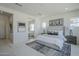 Inviting main bedroom with plush carpet, a king-sized bed, and ensuite bathroom access at 24000 S 218Th Pl, Queen Creek, AZ 85142