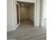 Office space featuring light wood floors, double glass doors, and bright lighting at 24000 S 218Th Pl, Queen Creek, AZ 85142