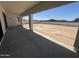Covered patio overlooking a spacious backyard with a concrete patio at 24000 S 218Th Pl, Queen Creek, AZ 85142