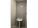 Half-bathroom featuring stylish pedestal sink with designer tile at 24000 S 218Th Pl, Queen Creek, AZ 85142