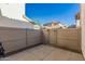 View of small backyard area enclosed by a fence and gate at 26521 N Babbling Brook Dr, Phoenix, AZ 85083