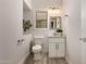 Modern bathroom featuring hexagon tile accent wall, vanity with storage, and updated fixtures at 26521 N Babbling Brook Dr, Phoenix, AZ 85083