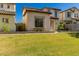 Inviting home boasts lush green grass, a classic tile roof, and desert landscaping at 26521 N Babbling Brook Dr, Phoenix, AZ 85083