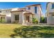 Lovely two-story home with a well-kept lawn, desert landscaping, and a welcoming entrance at 26521 N Babbling Brook Dr, Phoenix, AZ 85083