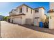 Paver driveway leads to two-car garage with adjacent side yard access at 26521 N Babbling Brook Dr, Phoenix, AZ 85083