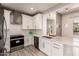 Modern kitchen featuring white cabinets, stainless steel appliances, and subway tile backsplash at 26521 N Babbling Brook Dr, Phoenix, AZ 85083
