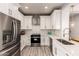 Beautiful kitchen with stainless steel appliances, white cabinetry, and quartz countertops at 26521 N Babbling Brook Dr, Phoenix, AZ 85083