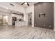 Open-concept living area with kitchen, modern floors, high ceilings and a TV wall at 26521 N Babbling Brook Dr, Phoenix, AZ 85083