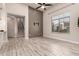 Inviting living room features modern floors, high ceilings, a large window, and staircase at 26521 N Babbling Brook Dr, Phoenix, AZ 85083