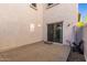 Patio area with sliding door, concrete floor, and stucco walls at 26521 N Babbling Brook Dr, Phoenix, AZ 85083
