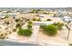A stunning aerial view captures the desert home, showcasing a long drive, lush trees and vast land, a true oasis at 27347 N Gary Rd, San Tan Valley, AZ 85144