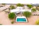 A stunning aerial view showcases the secluded backyard pool and patio surrounded by mature landscaping at 27347 N Gary Rd, San Tan Valley, AZ 85144