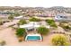 Breathtaking view from above showcasing the desert home's pool, offering a luxurious oasis in a natural setting at 27347 N Gary Rd, San Tan Valley, AZ 85144