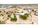 Aerial view of a desert home featuring a vast land area, blending comfort and potential in a natural setting at 27347 N Gary Rd, San Tan Valley, AZ 85144