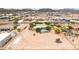 Aerial view of neighborhood showcasing property, surrounding desert landscape, and mountain views at 27347 N Gary Rd, San Tan Valley, AZ 85144
