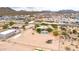 Expansive aerial view showcasing a desert home with a pool and generous land in a serene, mountainous setting at 27347 N Gary Rd, San Tan Valley, AZ 85144