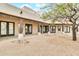 Covered outdoor patio featuring brick pavers and dark wooden beams at 27347 N Gary Rd, San Tan Valley, AZ 85144