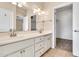A neutral bathroom with double sinks and a separate walk-in closet at 27347 N Gary Rd, San Tan Valley, AZ 85144