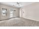 A neutral-toned bedroom with a view into the bathroom at 27347 N Gary Rd, San Tan Valley, AZ 85144