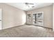A neutral-toned bedroom with a ceiling fan and access to the backyard at 27347 N Gary Rd, San Tan Valley, AZ 85144