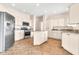 Bright kitchen featuring stainless appliances, white cabinets and granite counters at 27347 N Gary Rd, San Tan Valley, AZ 85144