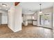 Bright open kitchen with tile flooring, light cabinets, and stainless steel appliances at 27347 N Gary Rd, San Tan Valley, AZ 85144
