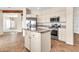 Well-equipped kitchen featuring stainless steel appliances and a center island at 27347 N Gary Rd, San Tan Valley, AZ 85144
