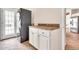 A laundry room with a stacked washer and dryer at 27347 N Gary Rd, San Tan Valley, AZ 85144