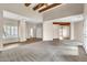 Spacious living room with high ceilings, exposed beams, and neutral tones at 27347 N Gary Rd, San Tan Valley, AZ 85144