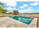 Backyard pool with elegant tiling and desert landscaping, providing a luxurious and inviting outdoor oasis at 27347 N Gary Rd, San Tan Valley, AZ 85144