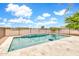 Backyard pool featuring a tiled pool deck, black metal fence and brilliant blue sky at 27347 N Gary Rd, San Tan Valley, AZ 85144