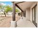 Covered walkway with decorative concrete pillars and a view of the desert landscape at 27347 N Gary Rd, San Tan Valley, AZ 85144