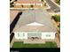 Well-maintained backyard featuring a covered patio, lush green grass, and ample space for outdoor activities at 32582 N Durango Ln, San Tan Valley, AZ 85143