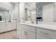 Bathroom with double sinks, elegant countertops, and decorative artwork at 32582 N Durango Ln, San Tan Valley, AZ 85143