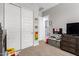 bedroom with a closet, a TV set, and decorations on the wall at 32582 N Durango Ln, San Tan Valley, AZ 85143
